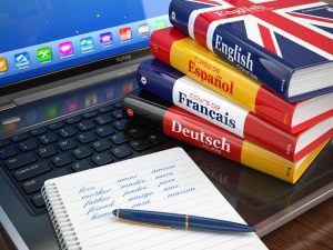 E-learning. Learning languages online. Dictionaries on laptop. E-learning. Learning languages online. Dictionaries on laptop.